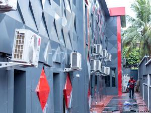 a blue building with a street with a building withrenderedrenderedrendered at Triple Tee Luxury Hotel & Service Apartments Surulere in Lagos