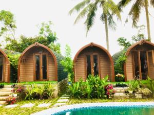 a house with a swimming pool in front of it at BUNGALOW DANANG Healing Homestay 