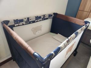 a baseball bed with a baseball bat on it at Apartamento Barra Pé na Areia in Rio de Janeiro