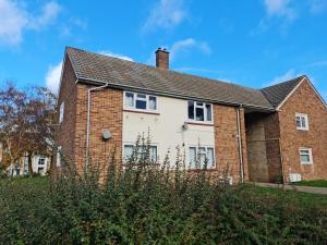 an old brick house with a roof at 2 Bed Spacious Apartment, Sleeps 5, Free Wifi, Free Parking, Amenities Nearby, Good Transport Links Nearby, Contractors and Holidays in Harlow