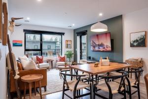 a living room with a table and chairs at Hemlock Hangout by Revelstoke Vacations in Revelstoke