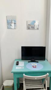 TV a/nebo společenská místnost v ubytování B&B Ligustico