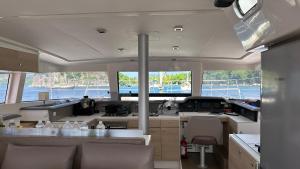 a large kitchen with a view of a boat at Unusual night in catamaran with dinner in Grand Case