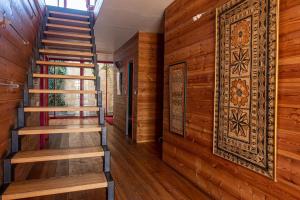 a staircase in a house with wooden walls at Large duplex house with terrace in Bordeaux in Bordeaux