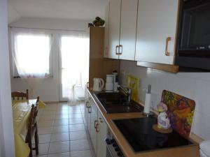 a kitchen with a sink and a counter top at Apartments Malo Misto in Zavalatica