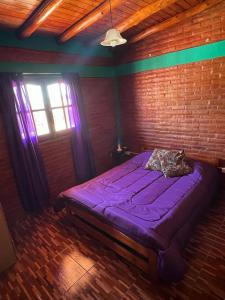 Ένα ή περισσότερα κρεβάτια σε δωμάτιο στο Departamentos La Familia