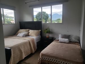 Postel nebo postele na pokoji v ubytování Villa Diosa
