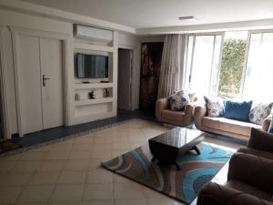 Гостиная зона в Ground floor villa with private garden, parking and shared swimming pool