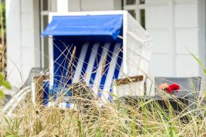 a blue box sitting outside of a house at Dorint Strandresort & Spa Westerland/Sylt in Westerland