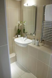 a bathroom with a sink and a mirror at Just a B in Winchester