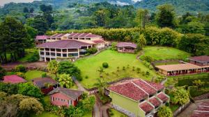 an aerial view of a house with a large yard at Hotel Montaña Monteverde in Monteverde Costa Rica