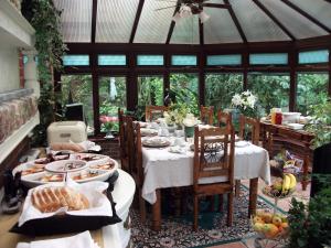 a dining room with a table with food on it at Beechwood B and B in Lewes
