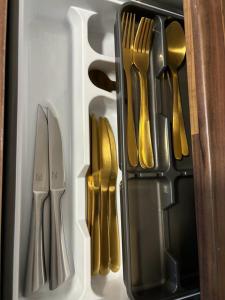 a drawer full of utensils in a refrigerator at Wohnen mit Panoramablick in Kornwestheim