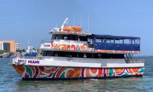 a colorful boat floating in the water at Miami on a Budget Under New Management All Female Rooms - All Men Rooms in Miami