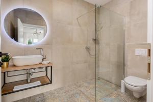 a bathroom with a shower and a sink and a toilet at Apartments and rooms with parking space Grabovac, Plitvice - 21931 in Rakovica