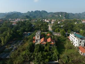 an aerial view of a city with trees and buildings at LittleTamCoc Boutique Villa Ninh Binh in Ninh Binh