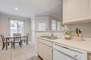 a kitchen with a sink and a table with chairs at Houston's City Center Apartment (5-Min Drive from Med Center) in Houston