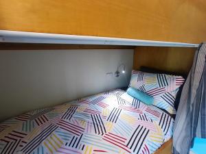 a bed on top of a bunk bed at Adventure Wanaka Hostel in Wanaka