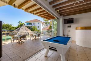 a pool table on the patio of a house at Noosa International Resort in Noosa Heads