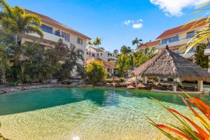 a swimming pool in front of a resort at Noosa International Resort in Noosa Heads