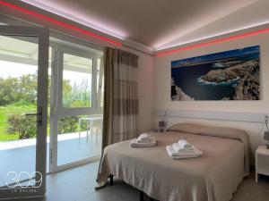 Кровать или кровати в номере 309 Le Saline - Stintino
