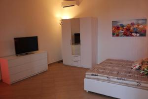 TV a/nebo společenská místnost v ubytování Tortugas B&B