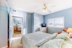 a bedroom with a bed and a ceiling fan at Captiva Bay 202 in Ocean City
