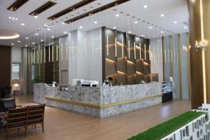 a lobby of a hotel with a reception desk at Benikea hotel seosan in Seosan