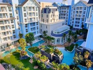 an aerial view of a resort with buildings at Grand Florida Beach condo in Na Jomtien