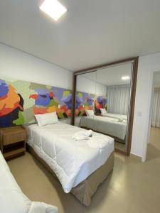 Ένα ή περισσότερα κρεβάτια σε δωμάτιο στο CAPIVARI ECORESORT