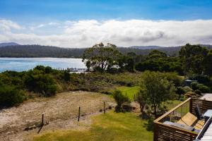 a view of a lake from a house at The Blue House in Coles Bay