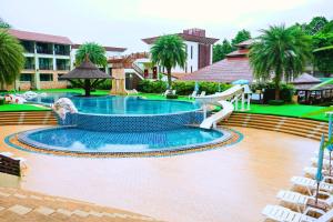 a pool with a water slide in a resort at Kacha Resort & Spa, Koh Chang in Ko Chang