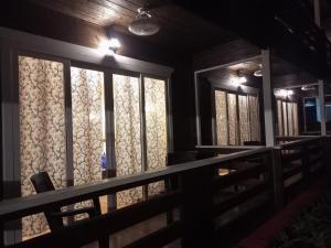 a room with windows with lights on them at Satva Cottages in Anjuna
