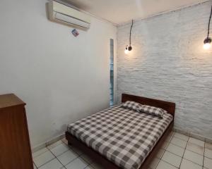 Letto o letti in una camera di Lucia Cottages