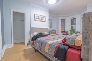 a bedroom with a bed with a fireplace in it at Stylish Downtown Apartment in Halifax
