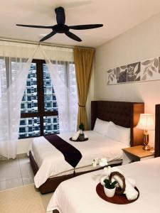 Giường trong phòng chung tại Bali Residence 1 Bedroom 3-6 Pax