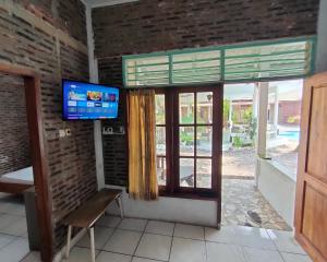 TV o dispositivi per l'intrattenimento presso Lucia Cottages
