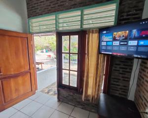 TV o dispositivi per l'intrattenimento presso Lucia Cottages