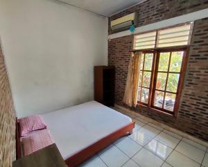 Letto o letti in una camera di Lucia Cottages