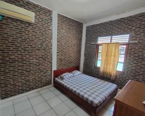Letto o letti in una camera di Lucia Cottages