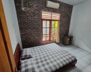 Letto o letti in una camera di Lucia Cottages