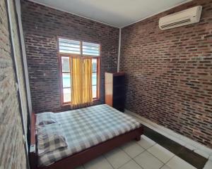 Letto o letti in una camera di Lucia Cottages
