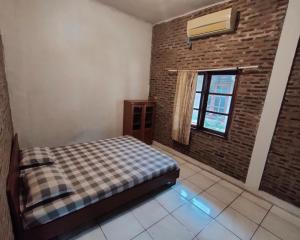 Letto o letti in una camera di Lucia Cottages