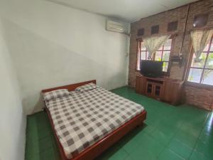 Letto o letti in una camera di Lucia Cottages