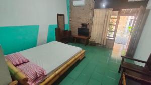 Letto o letti in una camera di Lucia Cottages
