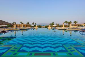 a swimming pool at a resort with a geometric design at Sheraton Soma Bay Resort in Hurghada