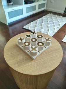 a round table with a bunch of cups on it at Sunny 2 bed Restaurants beach at door Pets O.K in Sydney +19 photos