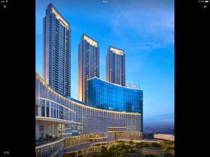 a group of tall buildings in a city at 2br- Central Park Residence Alaina Tower Floor 29 in Jakarta