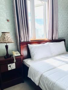 Voodi või voodid majutusasutuse LENA HOTEL toas