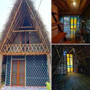 una casa con techo de paja y escalera en Open house en Auroville